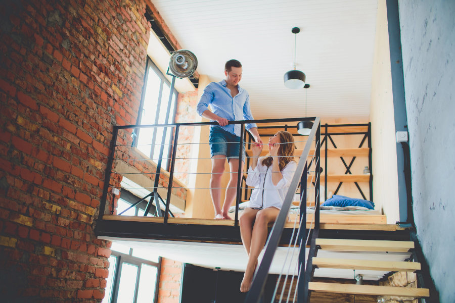 couple at home sitting on the second floor how to take a step back in a relationship - working together
