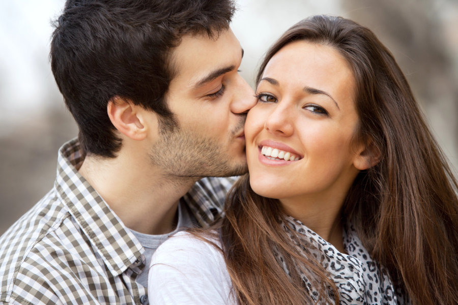 Close up kiss on girls cheek. how can u tell if he loves u - loving